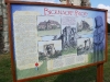 Information board at the priory arch